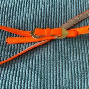 Retro leather belt with metal bow detail